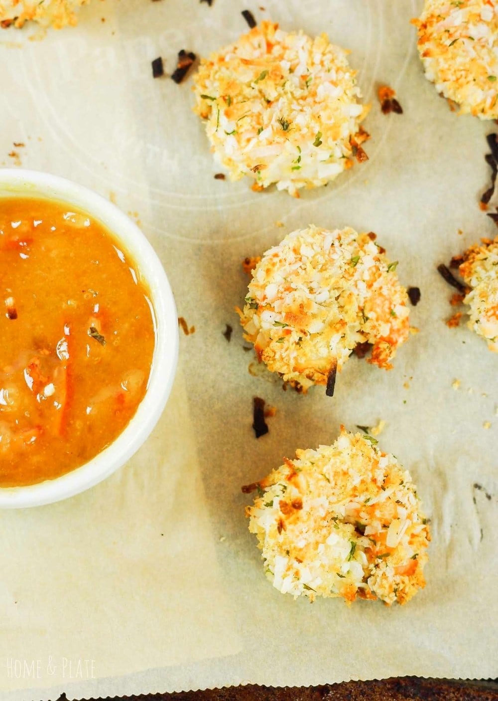 Baked coconut shrimp on a baking sheet.